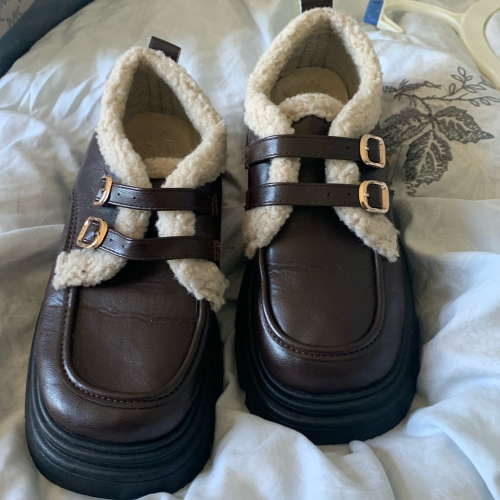 Cute fuzzy loafers with gold strap buckles!